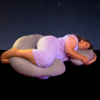 A woman peacefully sleeps on a pillow, with a serene starry sky illuminated behind her.